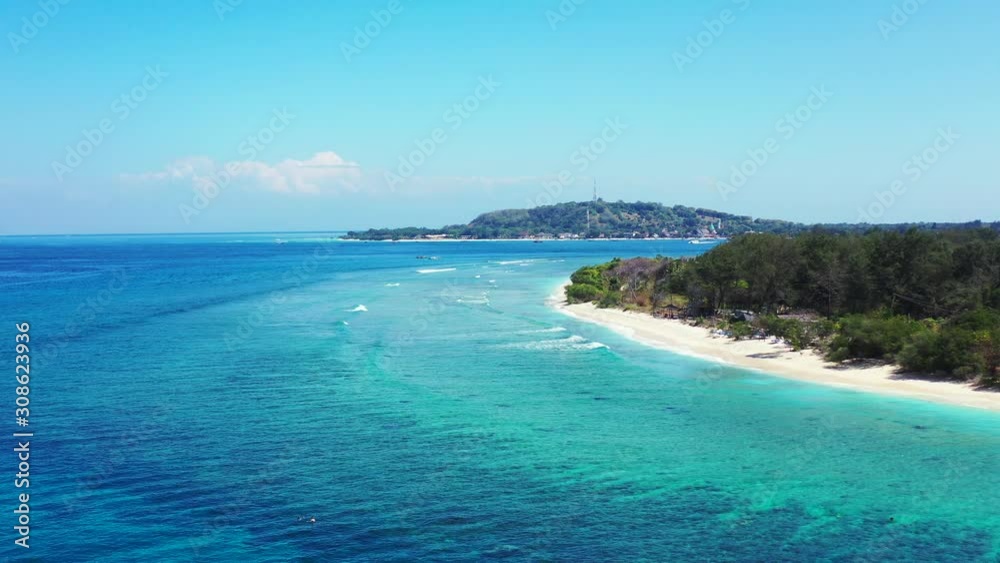Island In Vanuatu - Waves Calmly Splashing On The Shore Of Tropical Paradise Island Fringed With Green Trees And White Sand - Wide Shot Island In Vanuatu - Waves Calmly Splashing On The Shore Of Tropical Paradise Island Fringed With Green Trees And White Sand - Wide Shot
