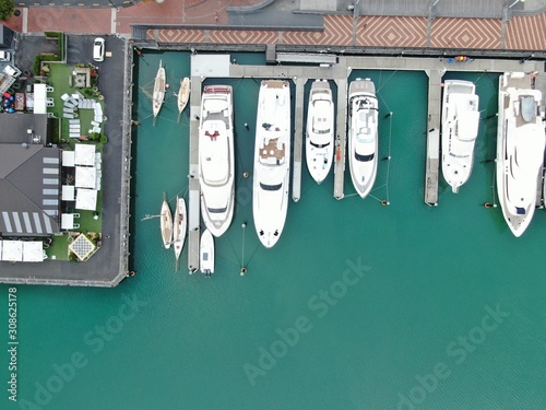 Viaduct Harbour, Auckland / New Zealand - December 9, 2019: The beautiful scene surrounding the Viaduct harbour, marina bay, Wynyard, St Marys Bay and Westhaven, all of New Zealand’s North Island photo