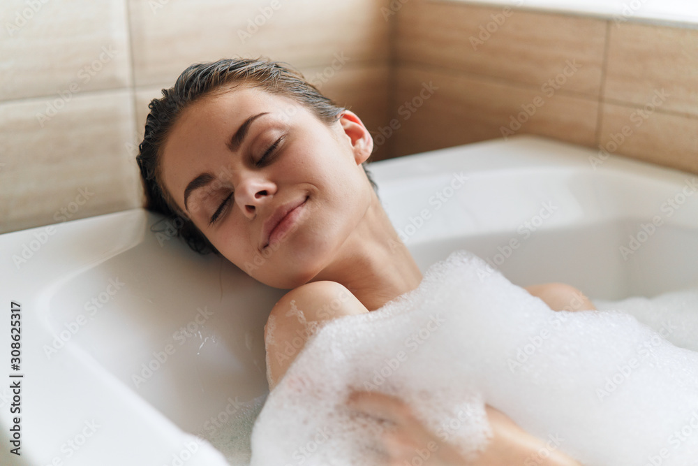 woman relaxing in bubble bath woman relaxing in bubble bath