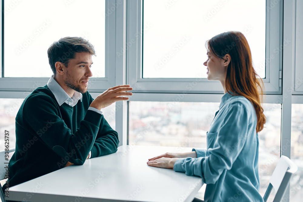 man and woman shaking hands in office man and woman shaking hands in office