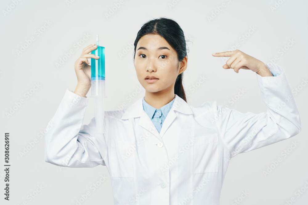young doctor with syringe isolated on white young doctor with syringe isolated on white