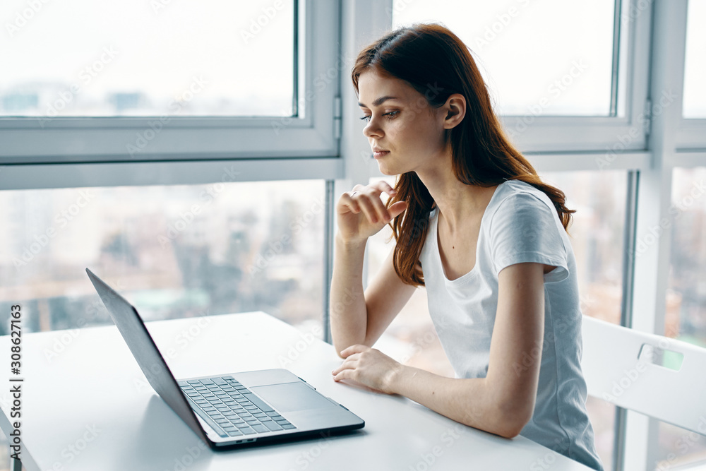 woman working on laptop at home woman working on laptop at home