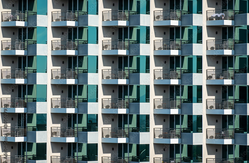 Pattern of hotel room balconies in modern building. Art
