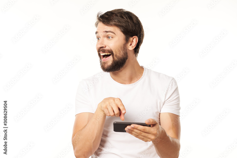 young man texting on mobile phone young man texting on mobile phone