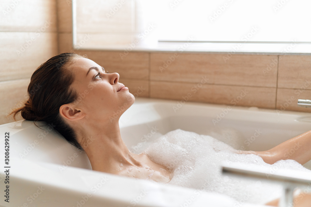 woman relaxing in bubble bath woman relaxing in bubble bath