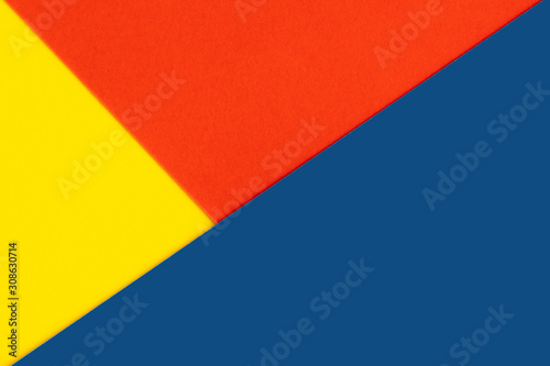 Yelllow blue red color paper background. Geometric figures, shapes. Abstract geometric flat composition. Empty space on monochrome cardboard. © Aisland