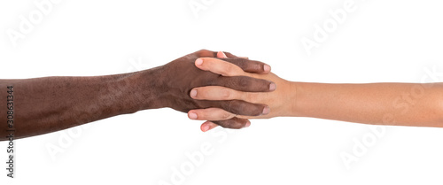 White Caucasian female hands and black African-American hands that grip the hand tightly