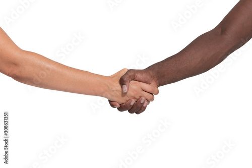 Black and white human hands. A strong handshake