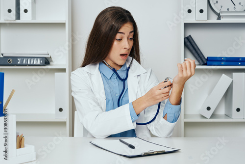 female doctor working on laptop in office