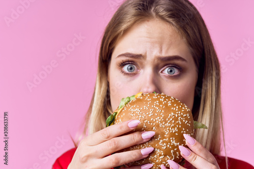 woman eating hamburger photo