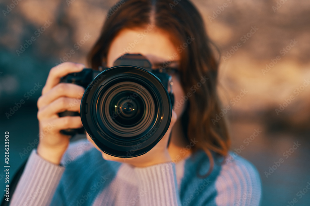 woman taking photo with digital camera woman taking photo with digital camera