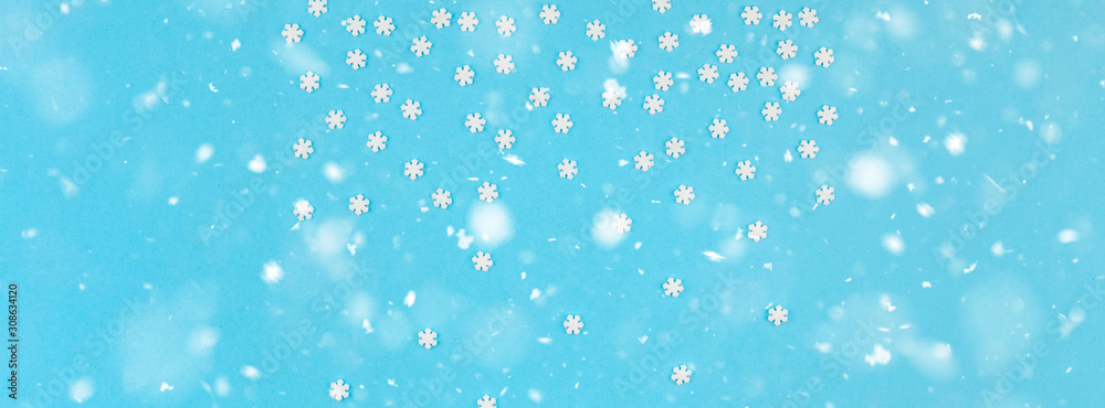 Winter pattern made of small white snowflakes Winter pattern made of small white snowflakes