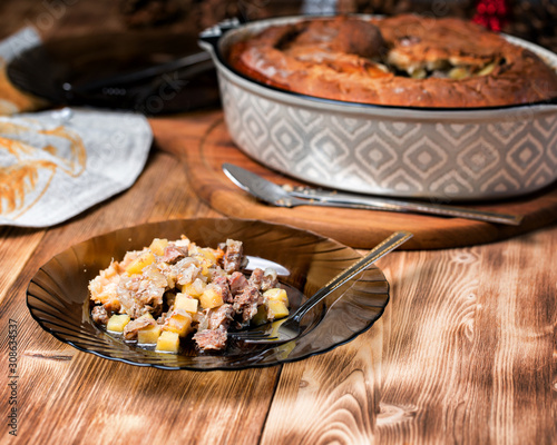 Freshly baked pie with duck meat, potatoes and onions. photo