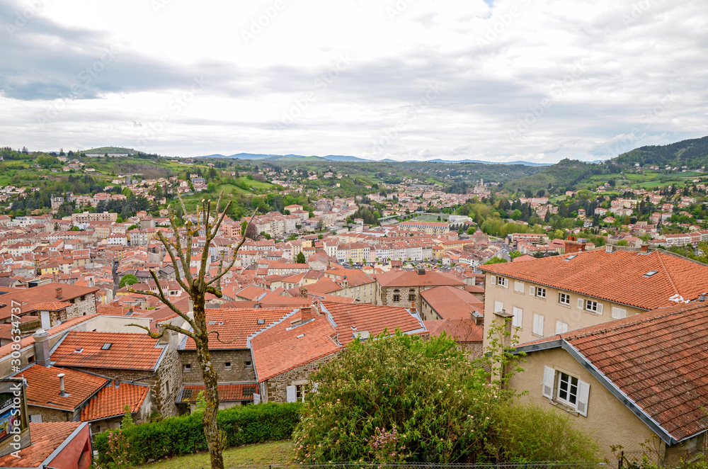 The hill view on orange roofs of le Puy-en-Velay city in France