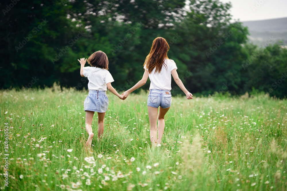 mother and daughter running in the park mother and daughter running in the park