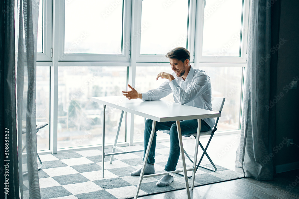 businessman sitting on bench and talking on cell phone businessman sitting on bench and talking on cell phone