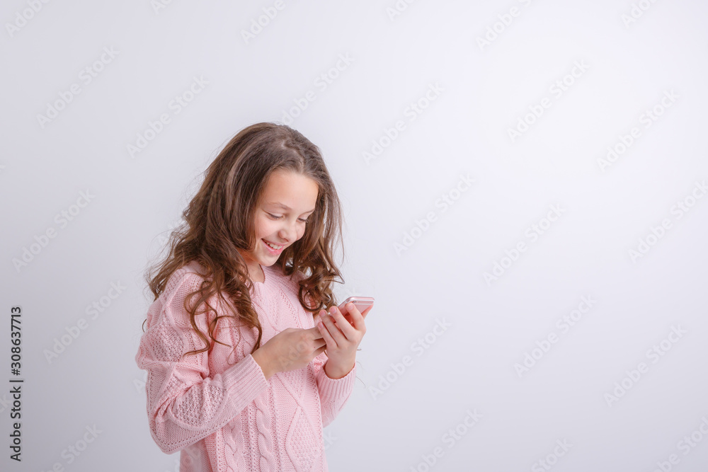 little girl with mobile phone in hands isolated on white background little girl with mobile phone in hands isolated on white background