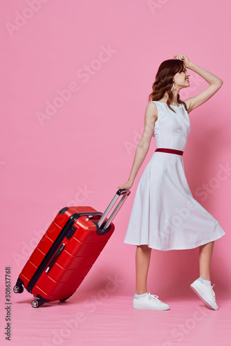 girl in dress with suitcase