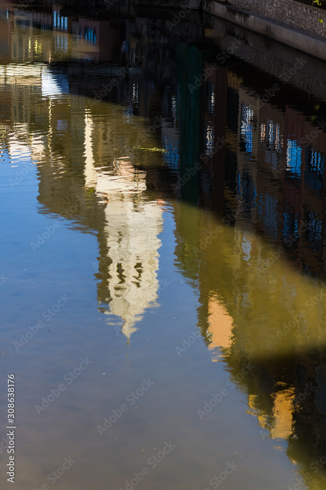 Girona's cathedral main landmark reflected on river quiet waters Girona's cathedral main landmark reflected on river quiet waters