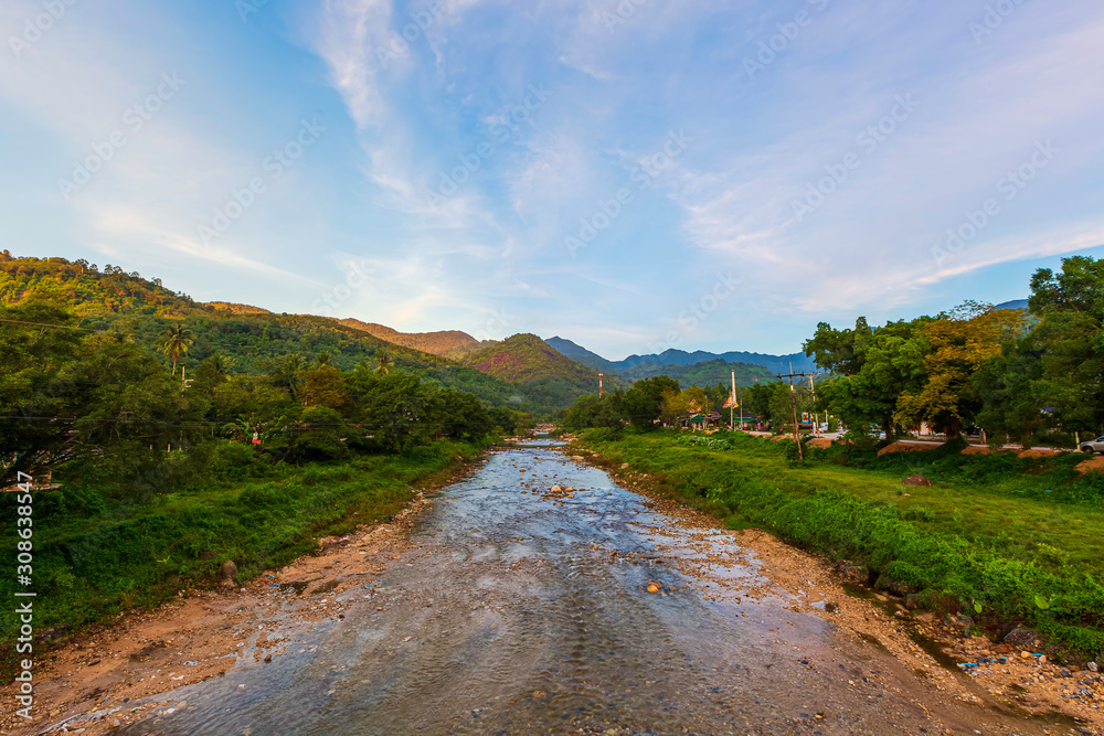 A small stream that flows down from a high mountain in Kiriwong village. Khiri Wong village has been certified as the best weather area in Thailand.