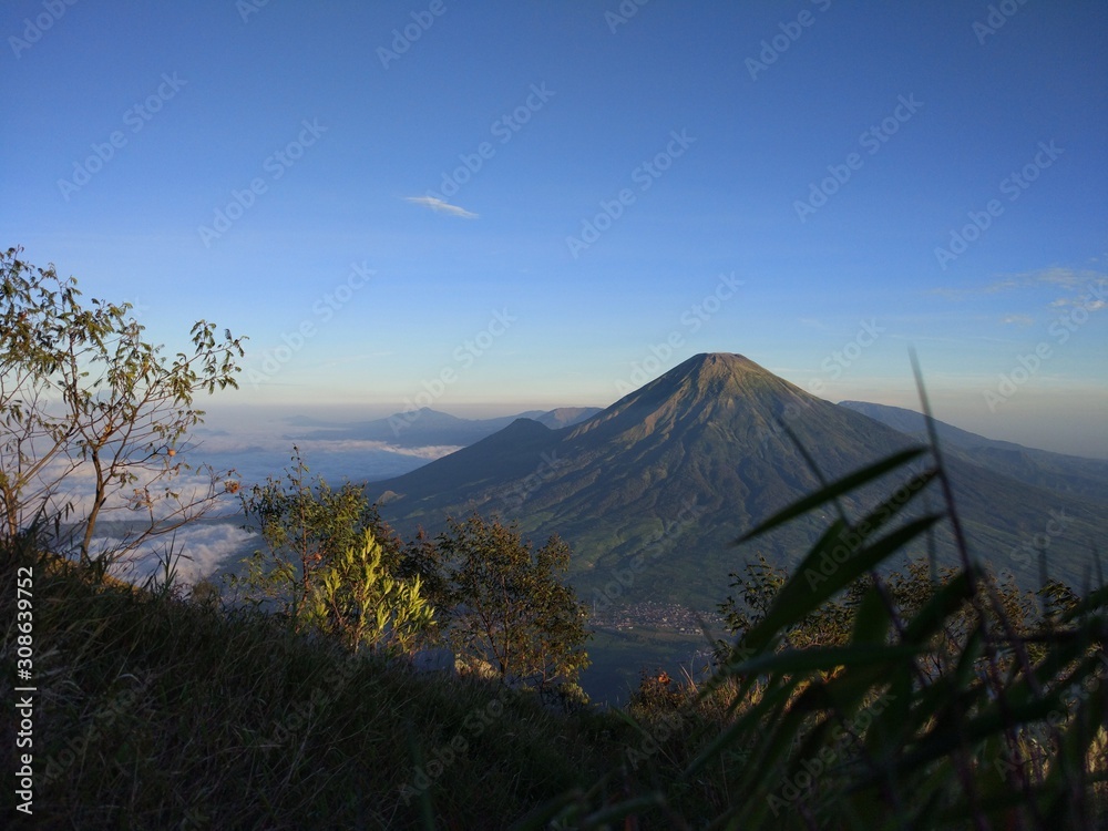 INDONESIA. AGUST 27, 2017. Camping trip tent on holiday, Adventures Camping tourism and tent with beautiful sunrise in place for camping at Mount Sumbing.