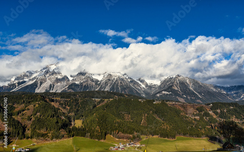 The snow capped "Dachstein" mountains and a panorama of Schladming, Styria, Austria 