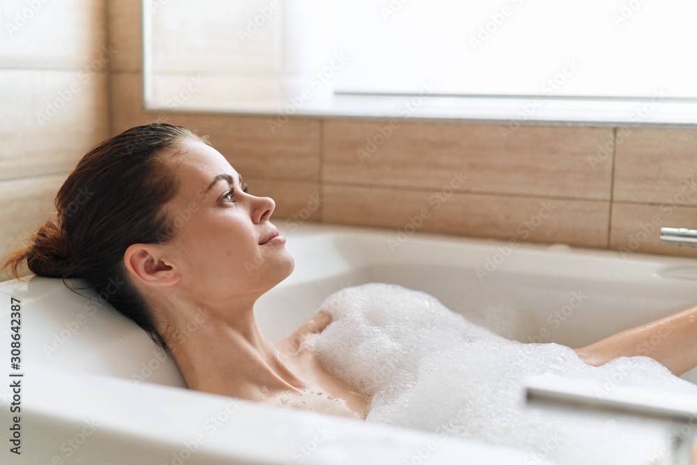 woman relaxing in bubble bath woman relaxing in bubble bath