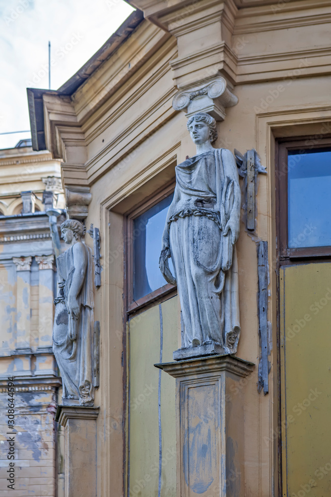 Caryatids are elements of the decoration of the palace of Grand Duke Mikhail Nikolaevich. Manor Mikhailovka. Peterhof. St. Petersburg. Russia Caryatids are elements of the decoration of the palace of Grand Duke Mikhail Nikolaevich. Manor Mikhailovka. Peterhof. St. Petersburg. Russia
