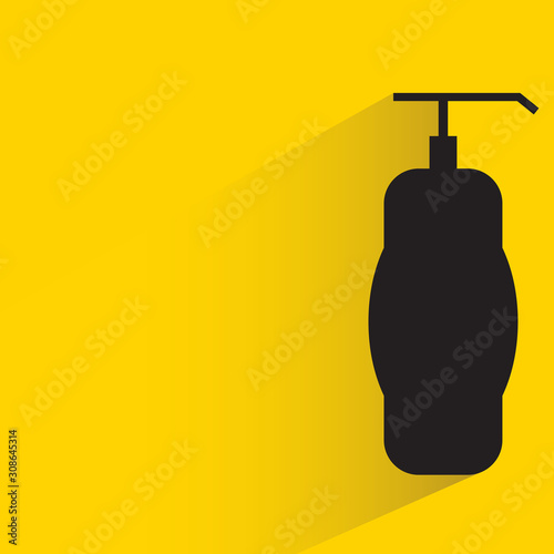 spray and perfume bottle with drop shadow yellow background