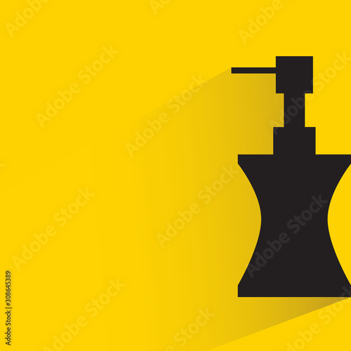 spray bottle with drop shadow in yellow background