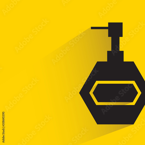 spray bottle with drop shadow in yellow background