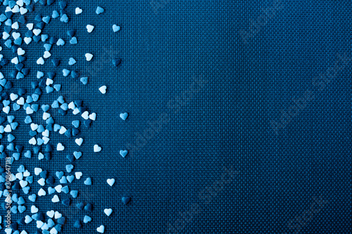Valentine day on blue background with blue and white hearts photo
