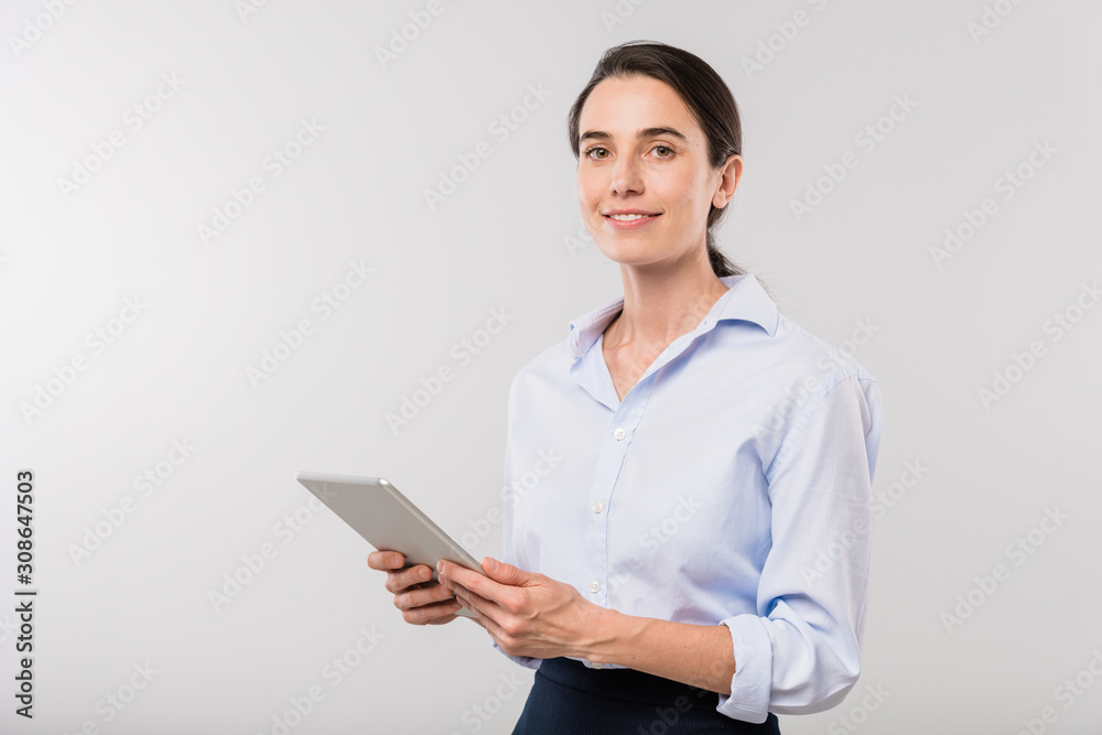 Young elegant businesswoman with touchpad surfing in the net in isolation Young elegant businesswoman with touchpad surfing in the net in isolation