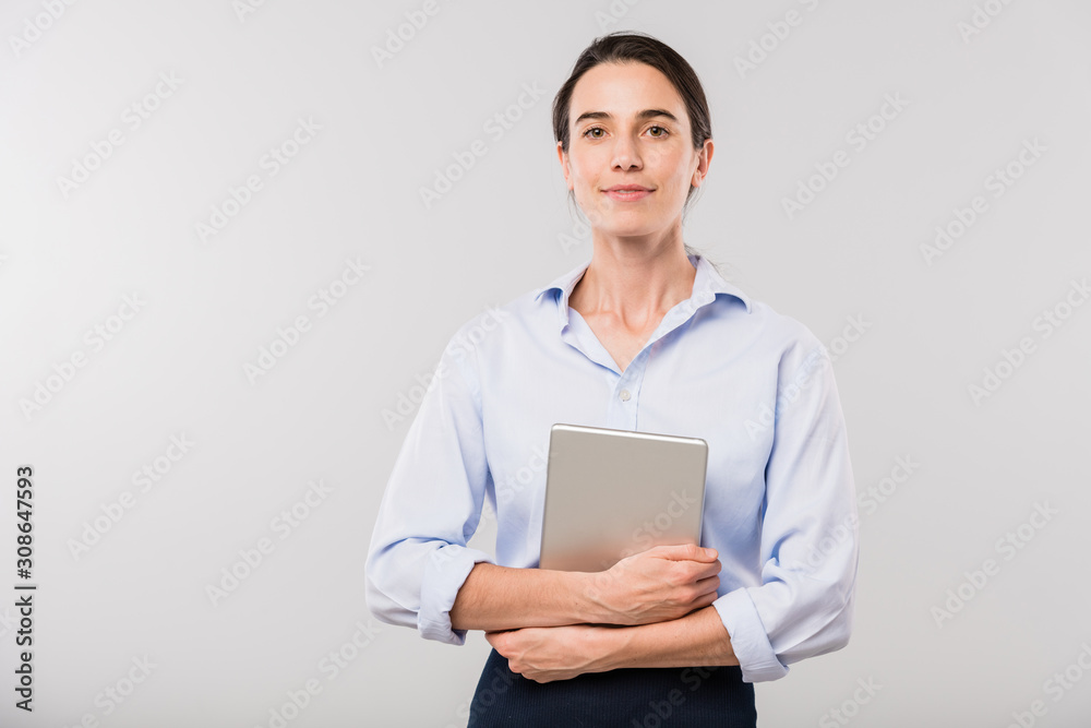 Young elegant businesswoman with touchpad standing in front of camera Young elegant businesswoman with touchpad standing in front of camera