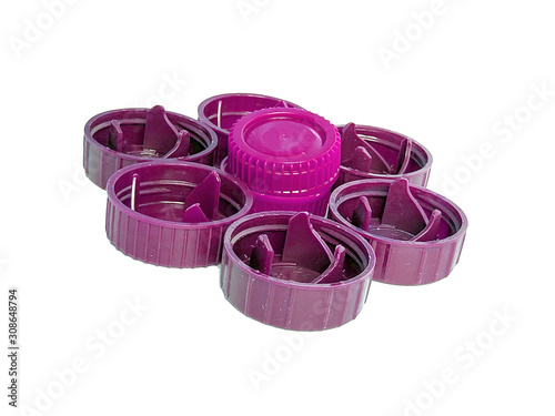 purple plastic bottle caps isolated on white background.