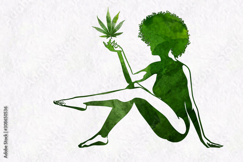 Woman's silhouette with afro hairstyle holding marijhuana leaf in her hand