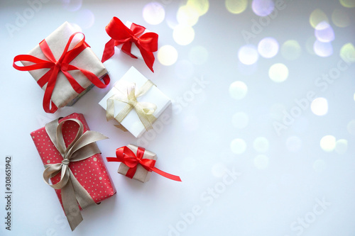 Present gift boxes with bow on white background.