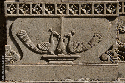 Carving details on the outer wall of the Vitthal Rukhmini Temple, Palashi, Parner, Maharashtra, India photo