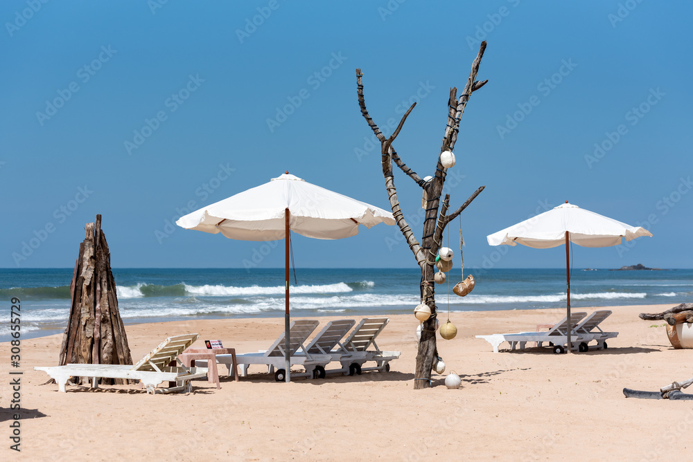 Indian ocean with golden sand, Bentota, Sri Lanka. A wonderful nature landscape of a beach scene.