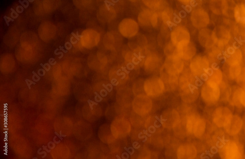 Bokeh light on an abstract orange background.