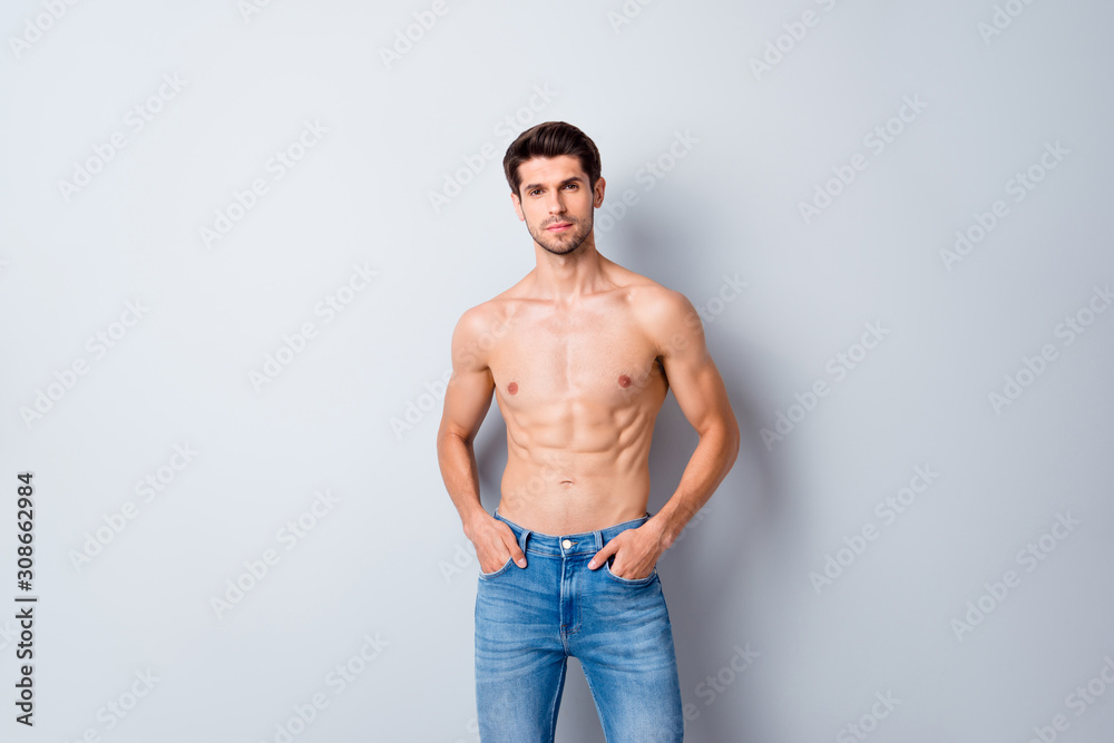 Portrait of his he nice attractive content cool fashionable muscular shirtless guy perfect figure form shape wearing jeans isolated over light white gray color pastel background Portrait of his he nice attractive content cool fashionable muscular shirtless guy perfect figure form shape wearing jeans isolated over light white gray color pastel background