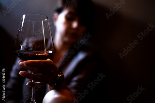 Close-up of the woman hands holding wineglass.