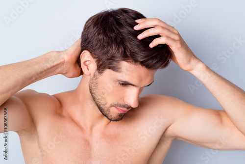 Close-up portrait of his he nice attractive stylish brown-haired guy touching smooth healthy shine hair anti dander medical healing isolated on light white grey color pastel background
