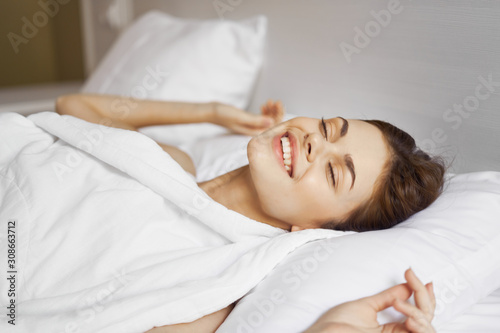 young woman sleeping in bed