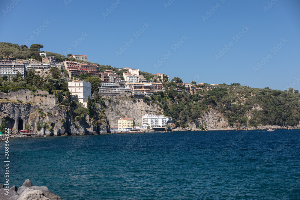  View of houses and hotels on the cliffs in Sorrento. Gulf of Naples, Campania, Italy