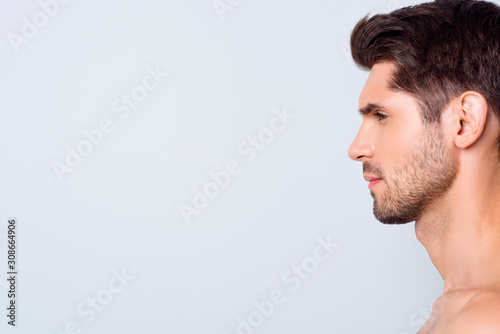 Closeup profile photo of macho model guy perfect neat hairstyle looking empty space focused salon spa refreshment procedures naked torso isolated grey background