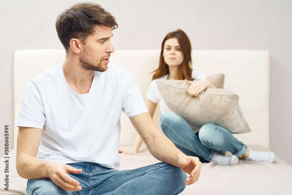 happy couple sitting on sofa and watching tv happy couple sitting on sofa and watching tv
