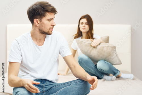 happy couple sitting on sofa and watching tv