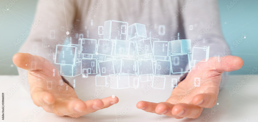 Businessman holding a Cloud of blockchain cube and binary data 3d rendering Businessman holding a Cloud of blockchain cube and binary data 3d rendering