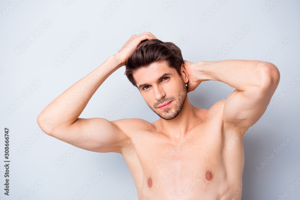 Close up photo of brutal macho man look mirror touch clean hairdo enjoy spa salon anti dander effect isolated over grey color background Close up photo of brutal macho man look mirror touch clean hairdo enjoy spa salon anti dander effect isolated over grey color background